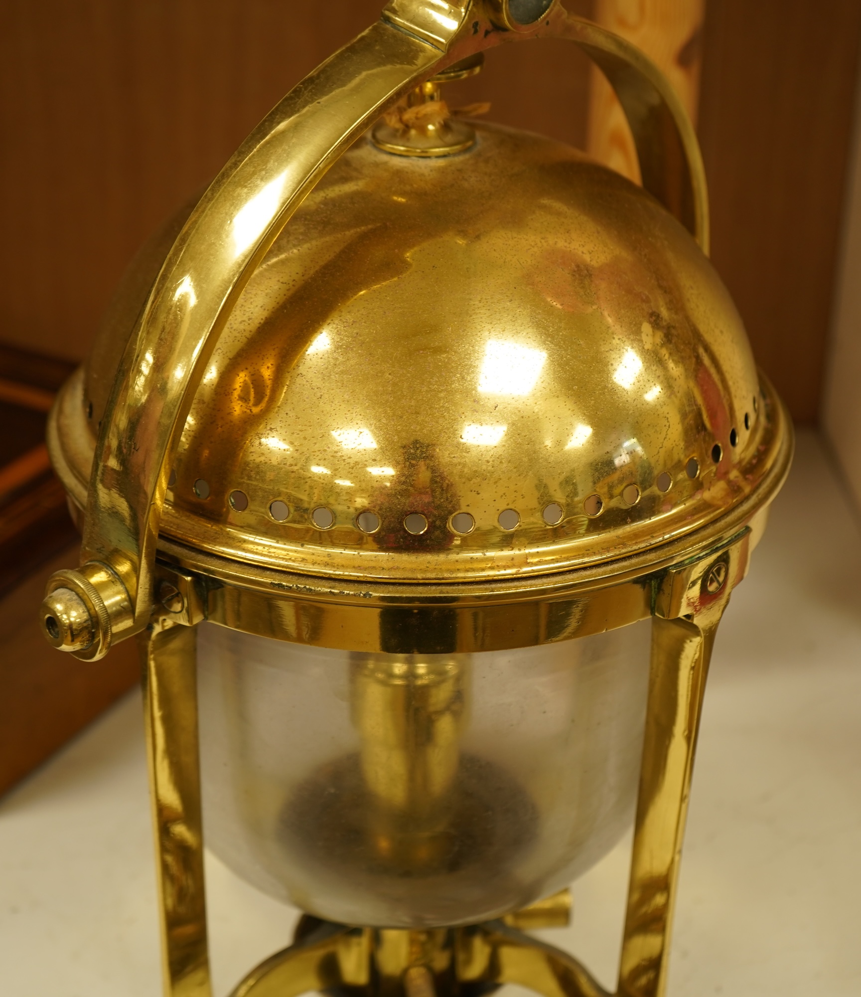 A brass ship's lamp on gimble, 41cm high